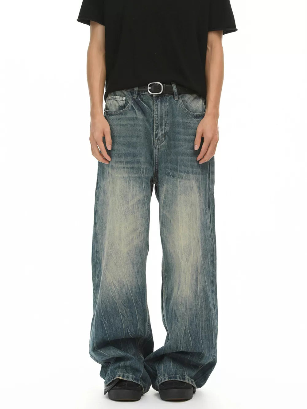 Men's baggy fit blue denim jeans with a faded wash and relaxed cut.