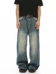 Men's baggy fit blue denim jeans with a faded wash and relaxed cut.