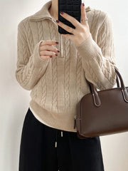 Beige cable knit quarter-zip pullover sweater with a relaxed fit.