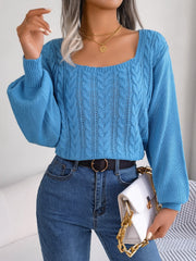 Azure cable knit sweater with square neckline and balloon sleeves.