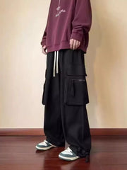 Black relaxed fit cargo sweatpants with drawstring and multiple pockets.