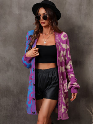 Colorblock leopard knit duster cardigan with button front and pockets.