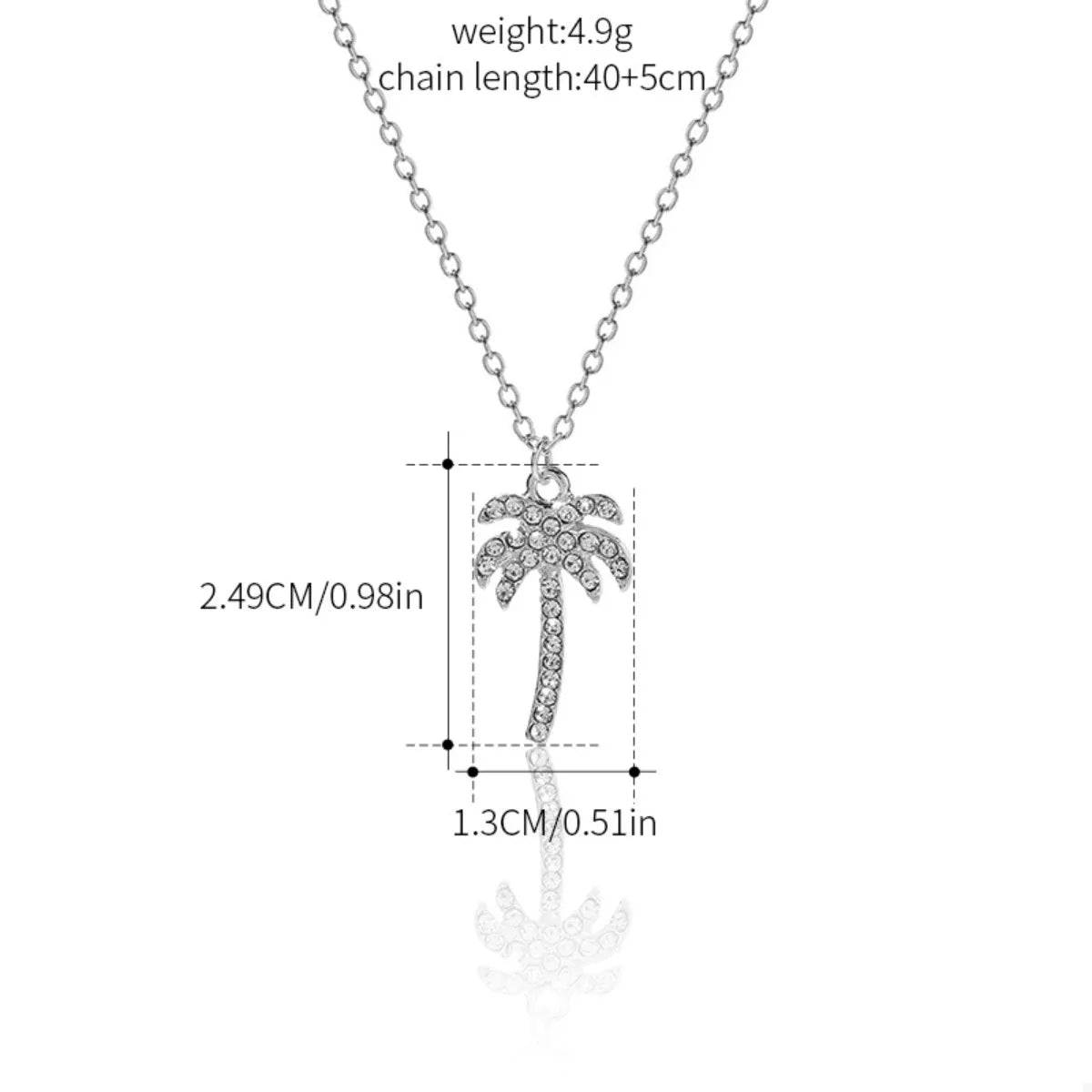Silver palm tree pendant necklace with clear rhinestones on a delicate chain.
