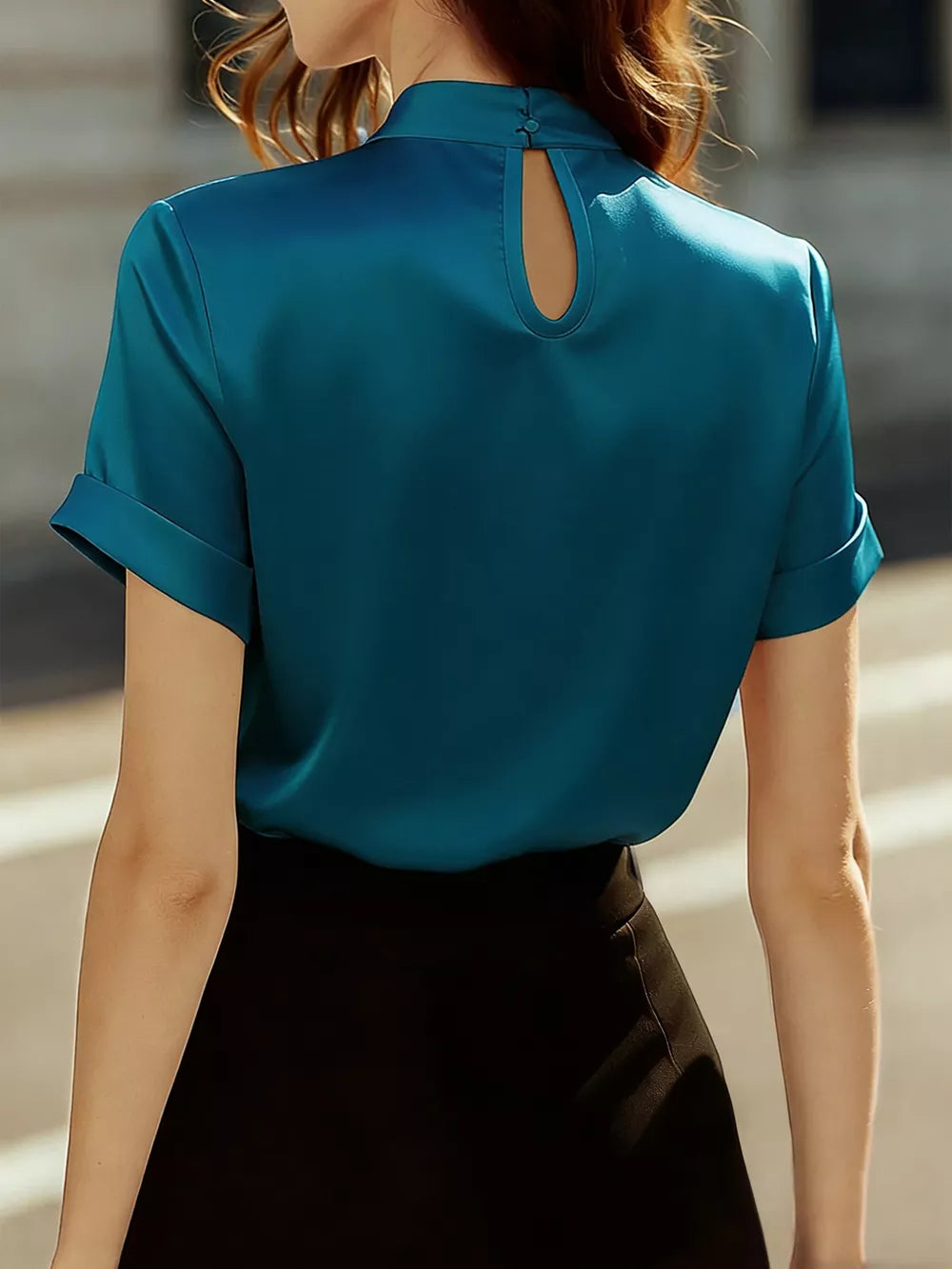 Peacock blue satin blouse with short sleeves and a keyhole neckline detail.