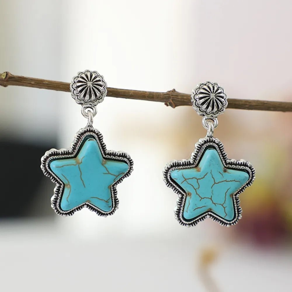 Southwestern starburst drop earrings in sky blue with distressed detail and silver-tone metal.