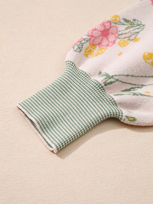 Floral knit sweater with green gingham cuff detail