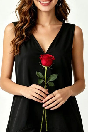 Black tiered ruffle hem mini dress with V-neck, held by a woman holding a red rose.