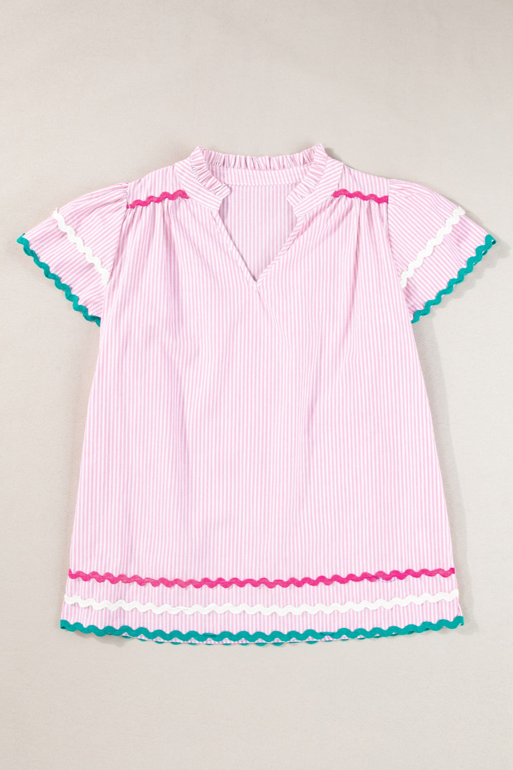 Blush pink striped blouse with ruffled neckline and scalloped trim sleeves and hem.