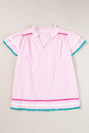 Blush pink striped blouse with ruffled neckline and scalloped trim sleeves and hem.