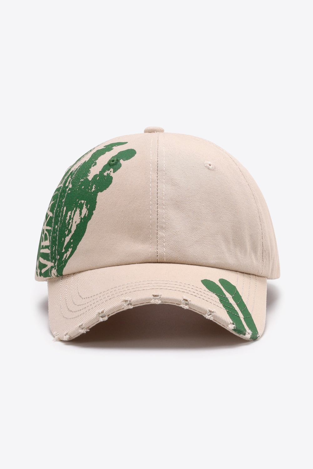 Sand baseball cap with distressed brim and green graffiti art detail.