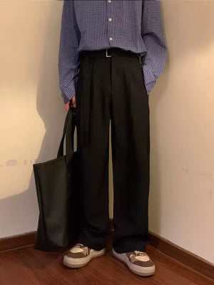 Black wide-leg sweatpants with belted waist and D-ring detail.