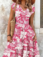 Tiered maxi dress in Strawberry floral print with smocked bodice and V-neck.