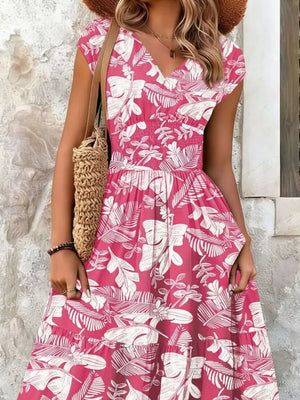 Tiered maxi dress in Strawberry floral print with smocked bodice and V-neck.