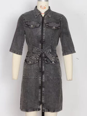 Grey denim shirt dress with zipper front, tie waist, and chest pockets.