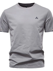 Gray t-shirt with embroidered crest detail and striped sleeve cuffs