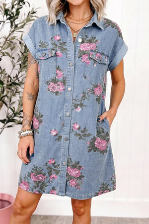 Denim shirt dress with pink floral print, short sleeves, button front, and chest pockets.