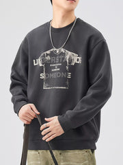 Men's dark gray oversized graphic sweatshirt with crew neck and long sleeves.