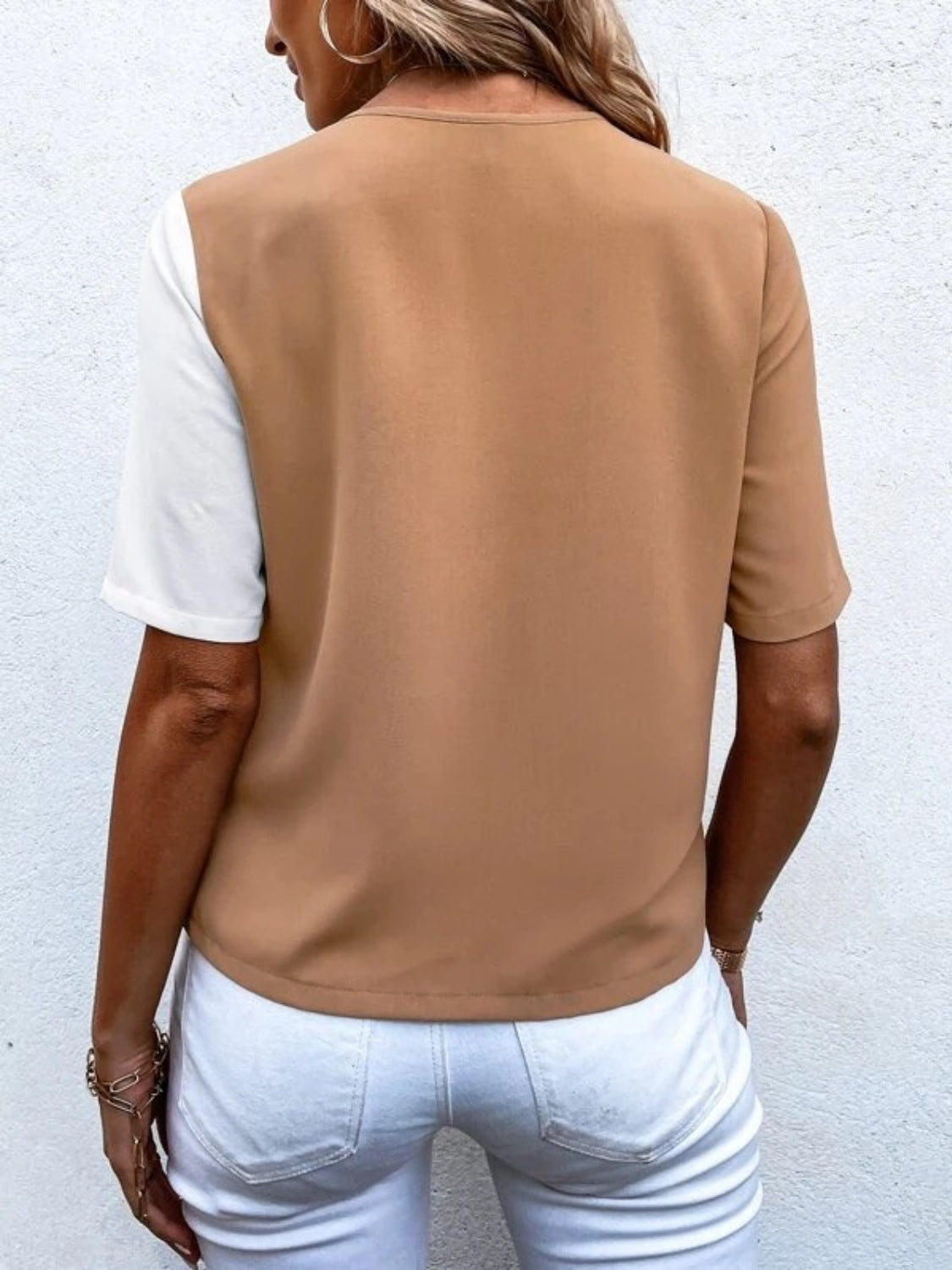 Two-tone shirt with brown and white colorblock, short sleeves, and a crew neck.