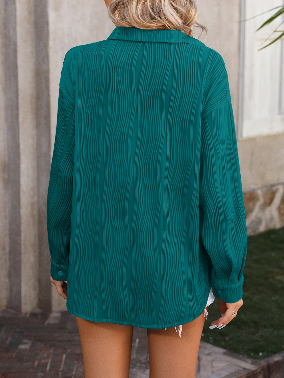 Textured button-down shirt in deep teal with a wavy pleated pattern.