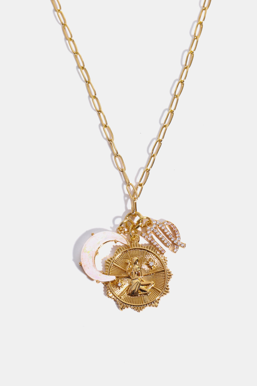 Gold celestial pendant necklace with zodiac charm, moon, and stars.