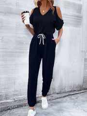 Dark blue cold-shoulder jumpsuit with drawstring waist and v-neckline