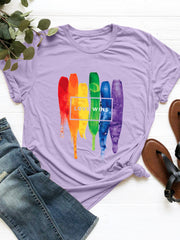 Lavender t-shirt with rainbow brushstrokes and "Love Wins" text graphic