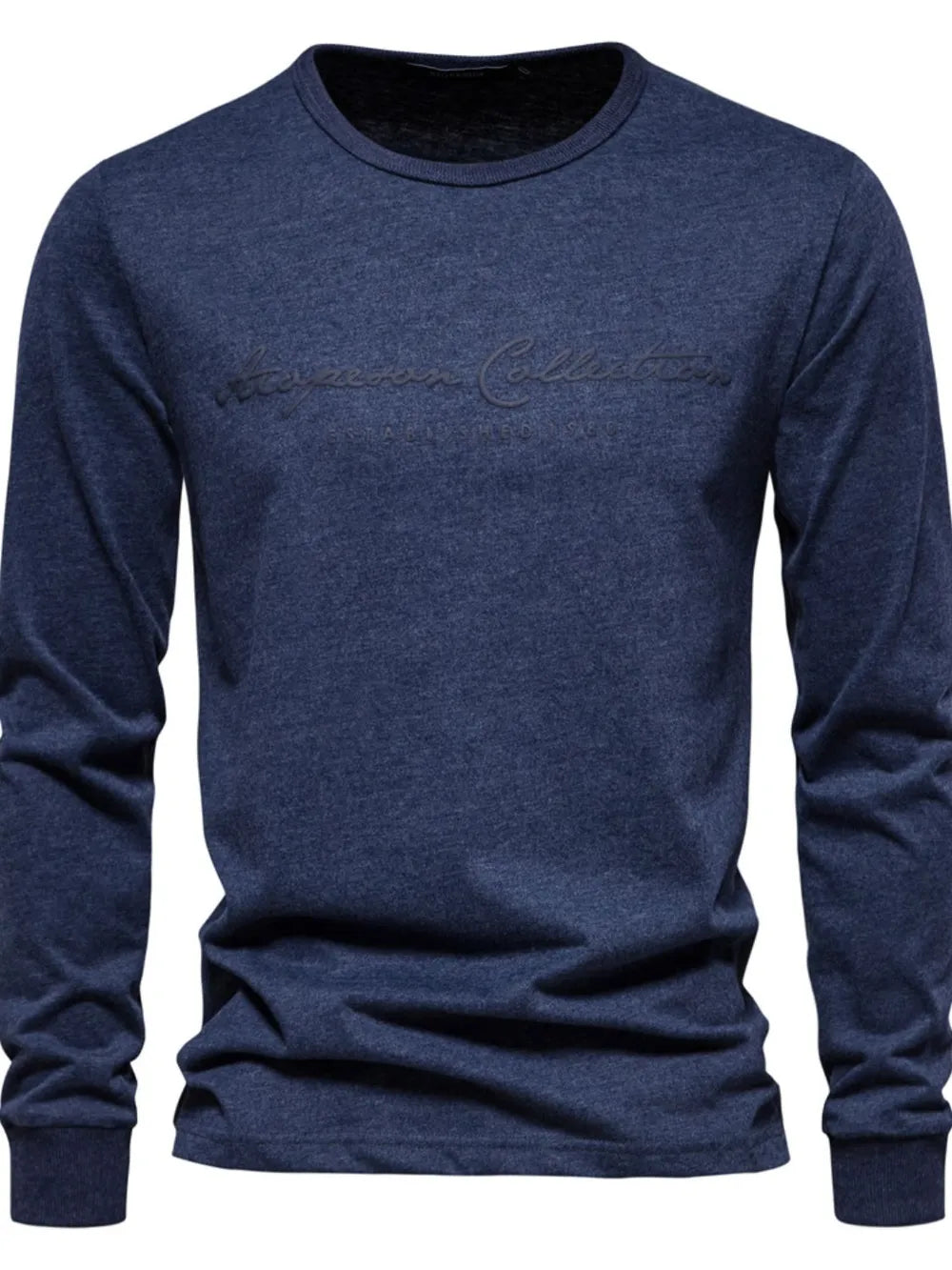 Navy crewneck long sleeve tee with embossed script logo detail.