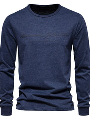 Navy crewneck long sleeve tee with embossed script logo detail.