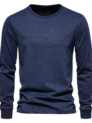 Navy crewneck long sleeve tee with embossed script logo detail.