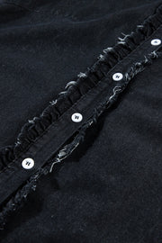Black denim button-up shirt with frayed ruffle trim and white buttons.