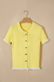 Yellow ribbed knit short sleeve cardigan with frilled trim and gold button details.