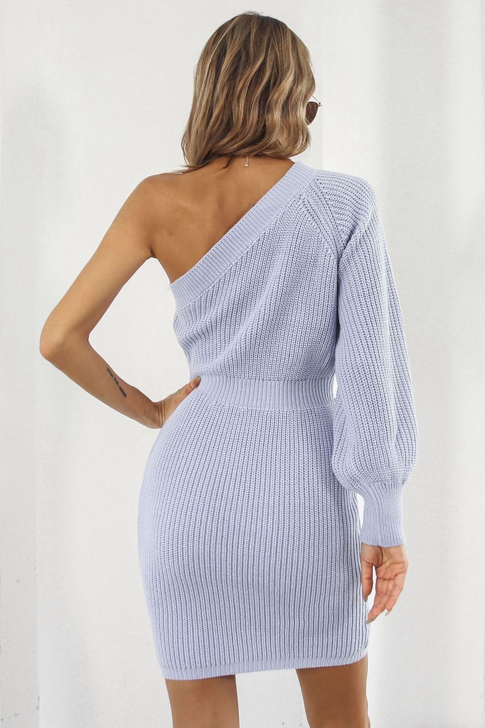 Lavender ribbed knit dress with asymmetric neckline and balloon sleeve.