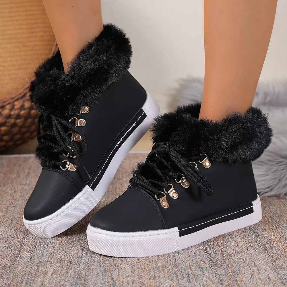Black fluffy cuff round-toe platform boots with white soles and laces.