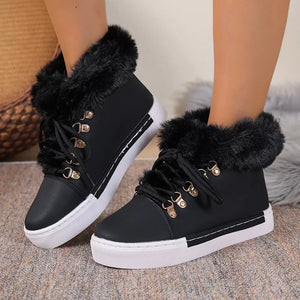 Black fluffy cuff round-toe platform boots with white soles and laces.