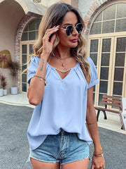 Light blue gathered sleeve blouse with plunge neckline and pearl detail