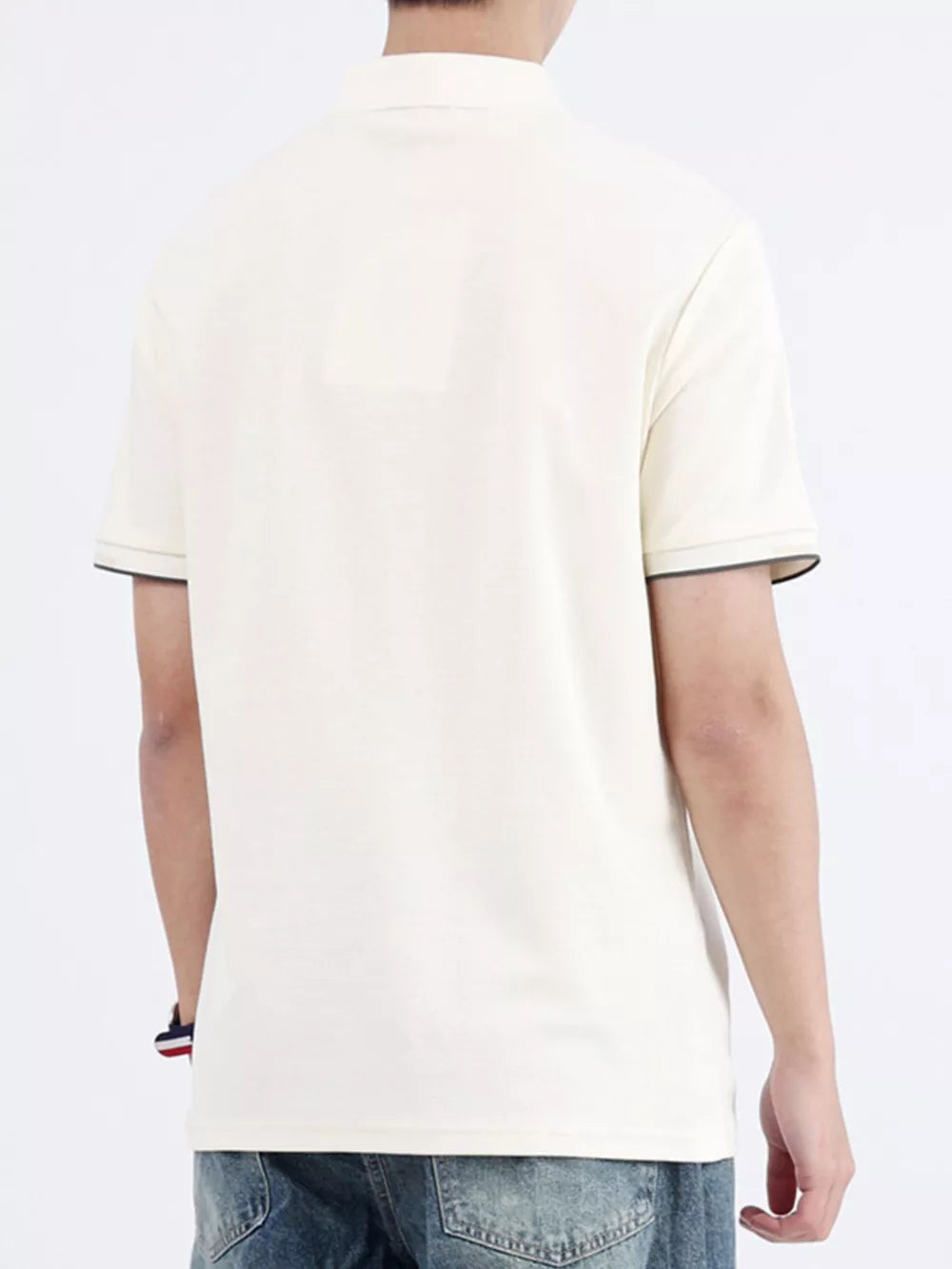Apricot cotton polo shirt with contrast trim on sleeves and collar.