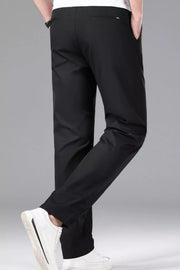Men's black slim-fit stretch dress pants with a clean, modern cut.
