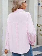 Relaxed fit blush pink pinstripe button-down shirt with back button detail.