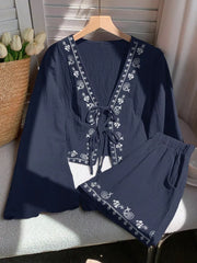 Navy embroidered tie-front top and shorts set with white paisley pattern.