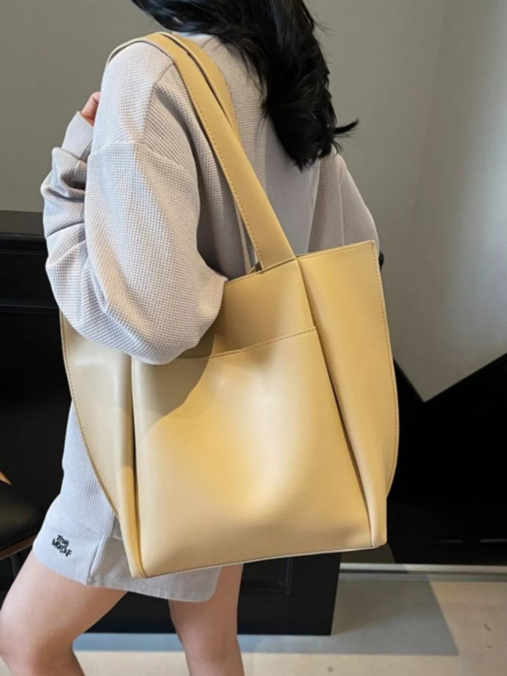 Khaki pu leather tote bag with single strap and front pocket detail