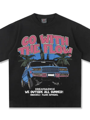 Black cotton graphic tee with "Go With The Flow" text, a blue car, and palm trees.