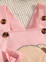 Pink corduroy baby set with bear applique and bow detail.