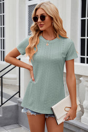 Light green perforated crewneck top with short sleeves and side slits