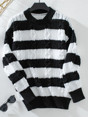 Black and white striped cable knit crewneck sweater with ribbed cuffs and hem.