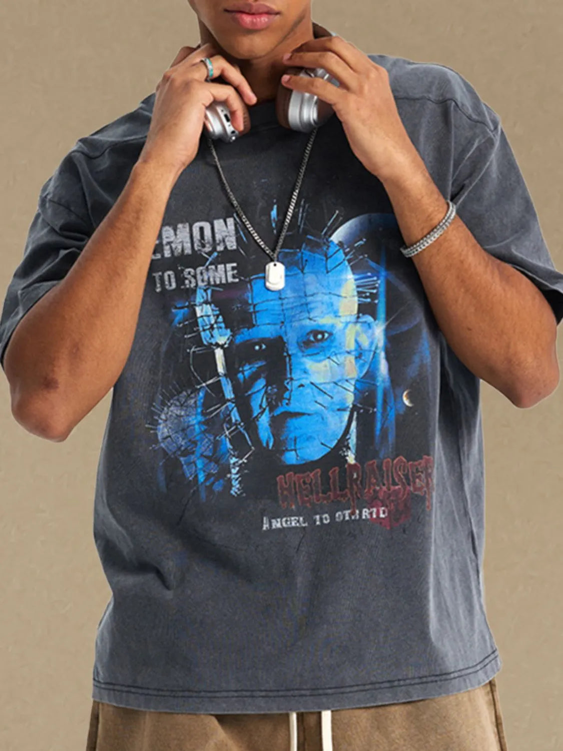 Dark gray relaxed fit tee with a graphic print of Pinhead from Hellraiser.