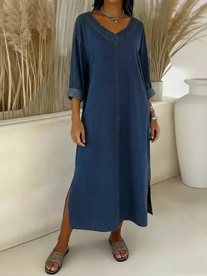 Denim midi dress in dark blue with V-neck, long sleeves, and side slit