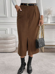 Brown corduroy midi skirt with a front slit and pockets.