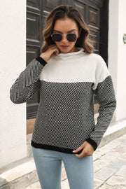 Chevron block mock neck knit sweater in black and white acrylic with a herringbone pattern.
