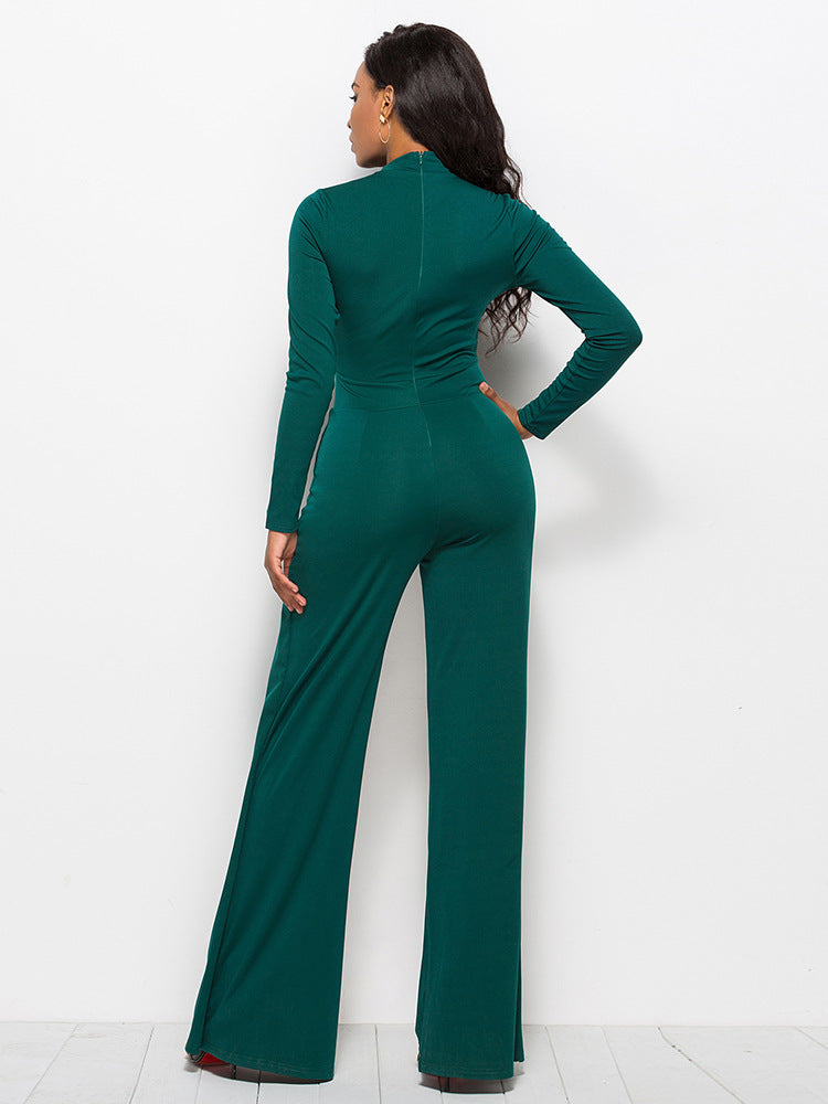Dark green high-waisted palazzo jumpsuit with long sleeves and a mock neck.