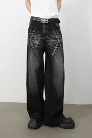 Dark wash wide leg jeans with sculpted detailing and a faded effect.